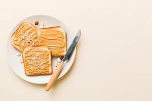 Peanut butter sandwiches toasts on light table background.Breakfast. Vegetarian food. American cuisine photo