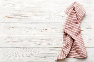 top view with red empty kitchen napkin isolated on table background. photo
