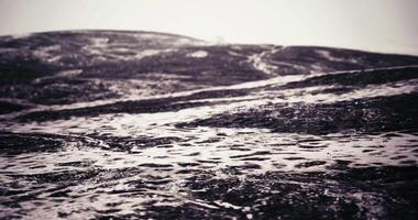 CGI Captivating waves create textures on the shoreline at dusk video