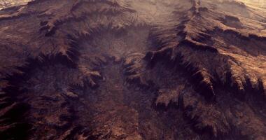 CGI Mountain terrain with deep valleys illuminated by warm sunlight at dusk video