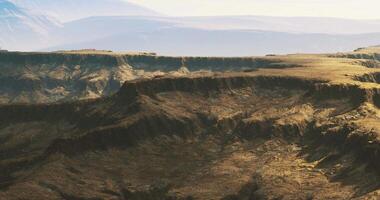 CGI Majestic cliffs overlook vast valleys in a serene landscape at sunset video