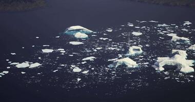 CGI Icebergs float serenely in a vast ocean landscape at sunrise video