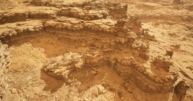 CGI Exploring unique rock formations in a dusty desert landscape at sunset video