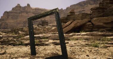 CGI Unique frame standing in a dry landscape with rocky mountains in the background video