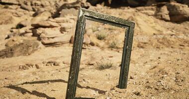 CGI Empty frame standing alone in vast desert surrounded by rocky formations video