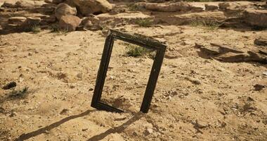 CGI Unique empty frame stands in the sandy desert landscape under bright sunlight video