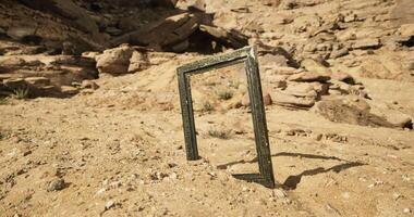 CGI Desert frame standing alone against rocky terrain in bright daylight video