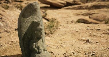 CGI Ancient stone carving discovered in an arid landscape during daylight hours video