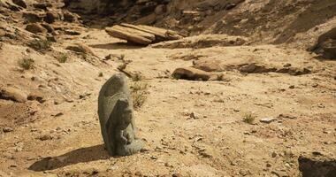 CGI Ancient stone carving located in a desert area showcasing cultural heritage video