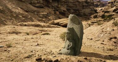 CGI Ancient stone sculpture of a figure discovered in a desert landscape video