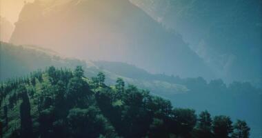 CGI Lush mountain landscape at dawn with mist settling over hills video