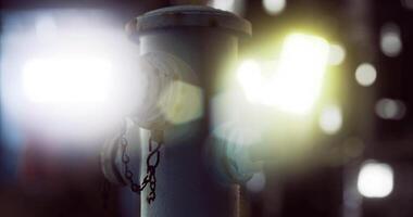 CGI Fire hydrant illuminated by ambient light in an urban setting at night video