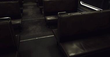 CGI Empty subway car interior reveals worn seats and dim lighting in urban setting video