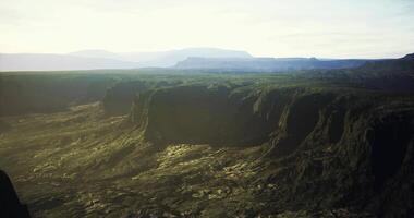 CGI Majestic mountain landscape with deep valleys and sunlight at dawn video