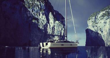 CGI Sailboat anchored in a serene cove surrounded by majestic cliffs at dusk video