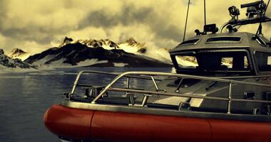 CGI Rescue boat navigating icy waters near snow capped mountains in daylight video