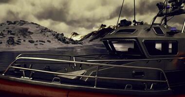 CGI Rescue vessel docked by rugged mountains under a cloudy sky video