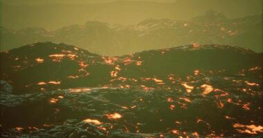 CGI Eruptive lava flows create a dramatic landscape in vibrant hues during twilight video