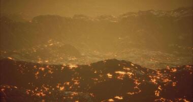 CGI Volcanic lava flow illuminated by the glow of molten rock at dusk video