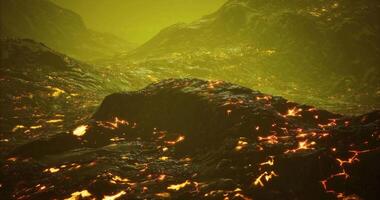CGI Lava flows illuminate the volcanic landscape under a greenish sky video