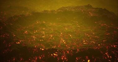 CGI Molten lava flowing and bubbling in active volcanic crater during sunset video