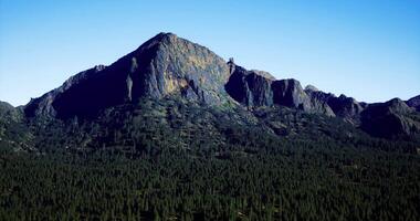 CGI Majestic mountain landscape under clear blue sky in a serene wilderness area video
