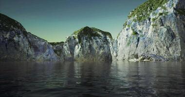 CGI Rocky cliffs reflect in calm water at twilight near the coastal shore video