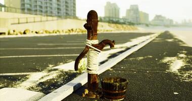 CGI Rusty water fountain tied with rope near beach promenade in early morning video