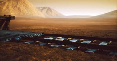 CGI Exploring an abandoned railway track in a remote desert landscape at sunset video