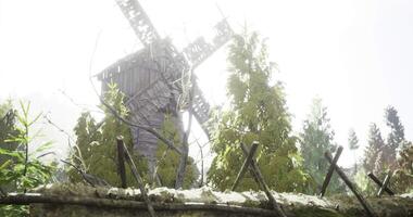 CGI Windmill surrounded by lush trees in a bright, sunny landscape setting video