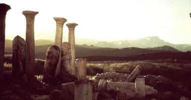 CGI Sunset over ancient ruins with weathered columns and historical sculptures video