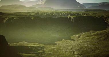CGI Twilight canyon landscape with lush greenery and distant mountains video