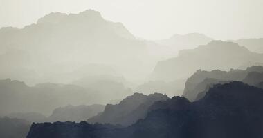 CGI Mountain silhouette layered in mist at dawn creates a serene atmosphere video