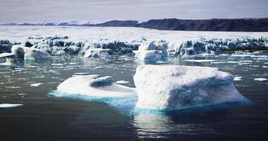 CGI Icebergs floating in tranquil waters near a scenic Arctic landscape video