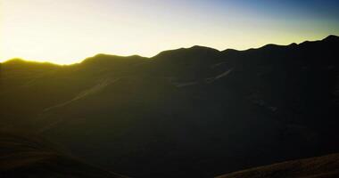 CGI Sunrise over mountain ridges in a serene landscape setting video