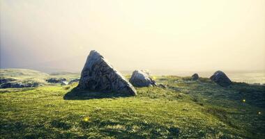 CGI Sunlight illuminating rocky landscape with vibrant greenery at twilight video