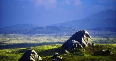 CGI Scenic view of expansive landscape with rocks under a blue sky video