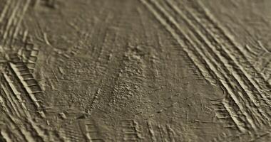 CGI Patterns created by tire tracks on a textured surface during the afternoon video