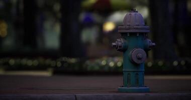 CGI Hydrant stands alone under soft light in a quiet urban setting at night video