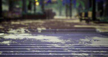 CGI Slick wet pathway reflecting trees and lights during a rainy evening video