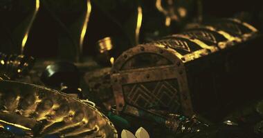 CGI Treasure chest surrounded by ancient artifacts in a dark cavern setting video