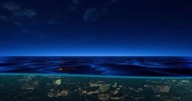 CGI Serene ocean view with clear water and rocks beneath the surface at twilight video