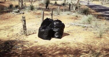 CGI Waste disposal in a natural area with trees and dirt road nearby video