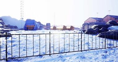 CGI Snowy landscape with structures and equipment in a remote location video