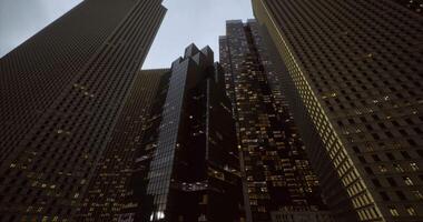 CGI Skyward view of modern skyscrapers in an urban setting at dusk video