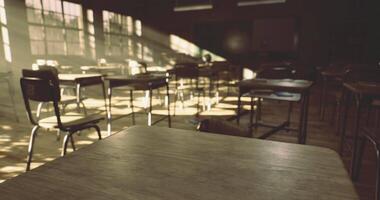 CGI Desks lined up in an empty classroom illuminated by sunlight video
