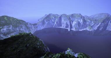 CGI Scenic mountain landscape overlooking a serene lake at dusk in nature video