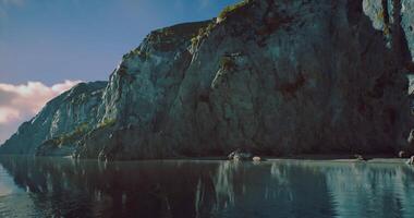 CGI Cliffs and calm waters reflect tranquility in a stunning coastal setting video