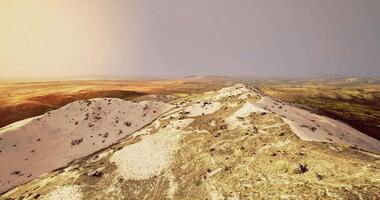 CGI Exploring a desert with rolling dunes and hills at sunset video