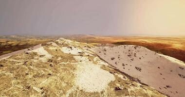 CGI Vast landscape of rolling dunes and hills in afternoon golden light video